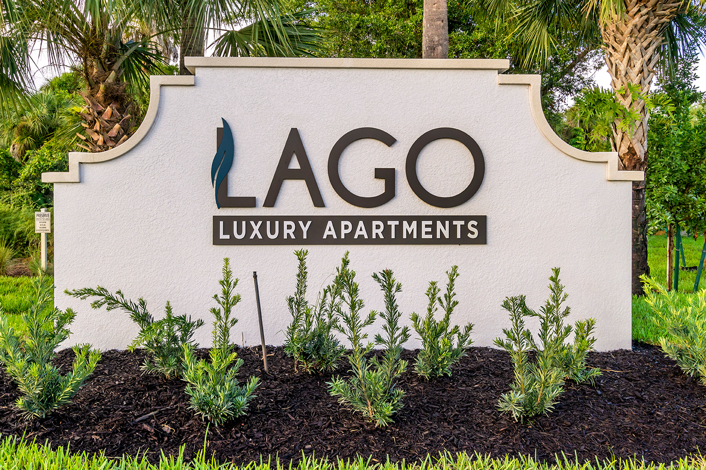 Monument sign for Lago luxury apartment community in Naples
